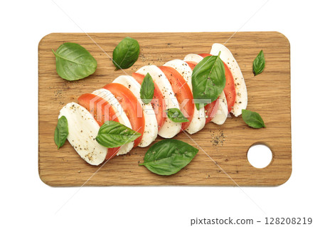 Mozzarella cheese with green basil leaves and tomato on cutting board isolated on white background 128208219