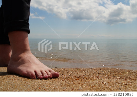 feet on a beach feet on a beach 128210985