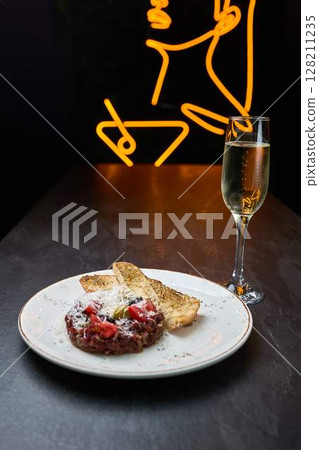 Beef tartare with toast and champagne pairing Beef tartare with toast and champagne pairing 128211235