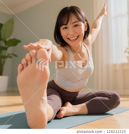 Smiling young woman stretching. Healthy morning routine. 128212225