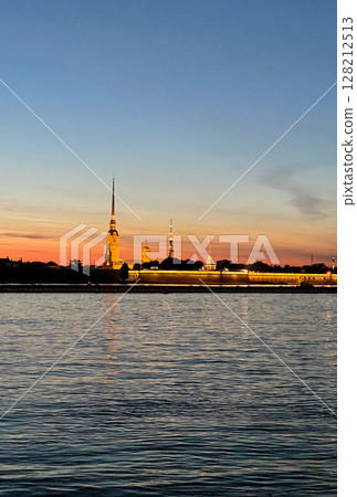 Peter and Paul Fortress in Saint Petersburg, Russia. Beautiful view of the landmark during white nights. Vertical photography. 128212513