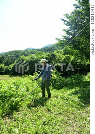 Seniors mowing the grass 128213412