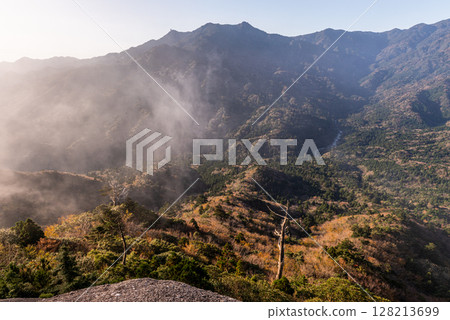 Mysterious and fantastical autumn scenery from Taiko Rock, Yakushima, in the offshore Alps Mysterious and fantastical autumn scenery from Taiko Rock, Yakushima, in the offshore Alps 128213699
