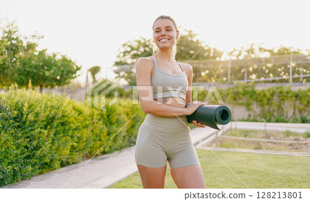 A smiling fitness enthusiast practices yoga in a sunlit garden, surrounded by greenery A smiling fitness enthusiast practices yoga in a sunlit garden, surrounded by greenery 128213801