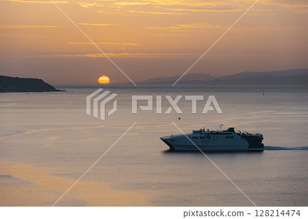 View of a ferry at sunset entering the port of Ceuta 128214474