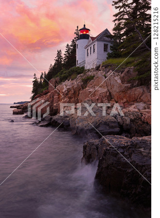 Bass Harbour Lighthouse at sunset with dramatic rocks and Atlantic Ocean on the foreground, Acadia National Park, Maine, USA Bass Harbour Lighthouse at sunset with dramatic rocks and Atlantic Ocean on the foreground, Acadia National Park, Maine, USA 128215216
