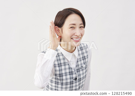 Female office worker listening gesture white background 128215490