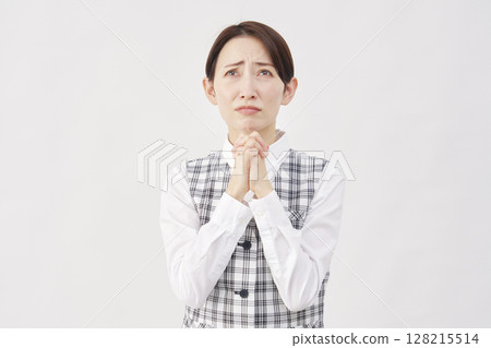 Female office worker pleading on white background Female office worker pleading on white background 128215514