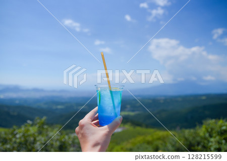 Drinking lime soda while taking in the spectacular view 128215599