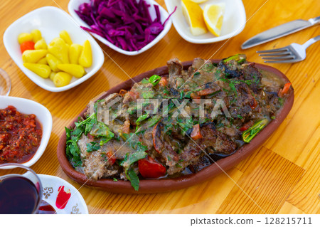 Turkish dish tirit and meze served on table Turkish dish tirit and meze served on table 128215711