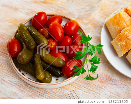 Appetizing pickled cucumbers and tomatoes 128215805