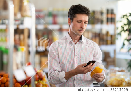 Man scanning smoothie 128215909