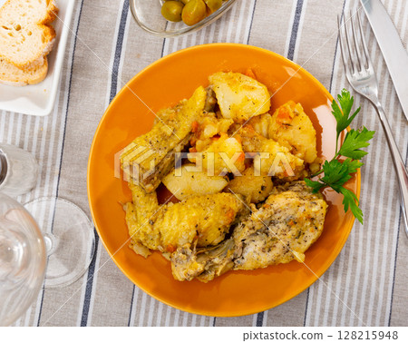 Baked chicken pieces with home-style stew potatoes for dinner Baked chicken pieces with home-style stew potatoes for dinner 128215948