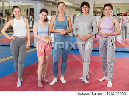 Group portrait of athletic women in self defense gym 128216030