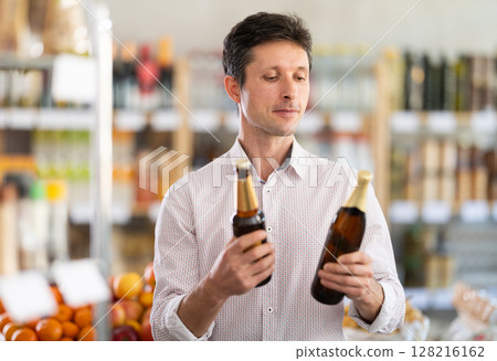man chooses craft beer 128216162