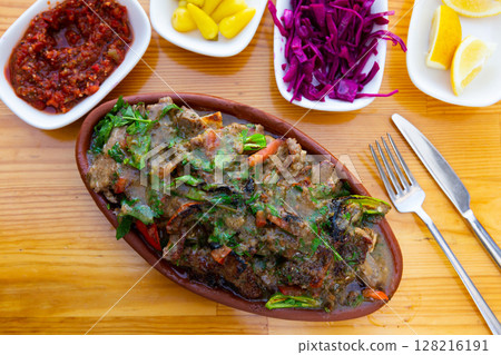 Turkish dish tirit and meze served on table 128216191