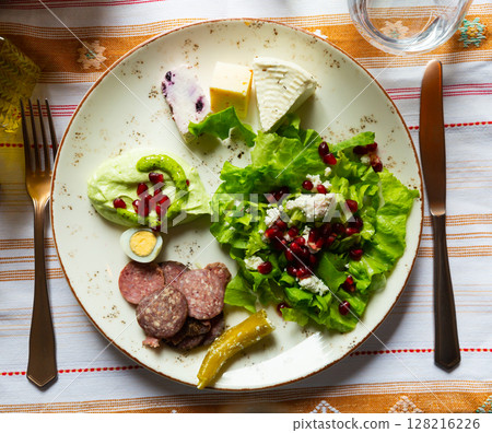 Albanian appetizers of salad, jatrash mixture and salke kosi 128216226
