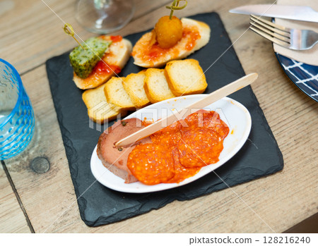 Various tapas served on black board 128216240