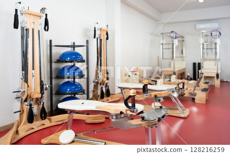 Equipment for Pilates -reformer bed, multifunctional bench, pilates apparatus with rope in gym 128216259