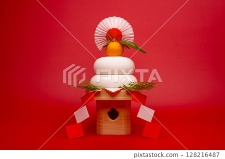 Photo with “Kagami-mochi” placed in the center, red background, with Sanpo (pedestal) Photo with “Kagami-mochi” placed in the center, red background, with Sanpo (pedestal) 128216487