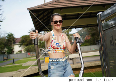 A young woman enjoying an workout outdoors A young woman enjoying an workout outdoors 128217487