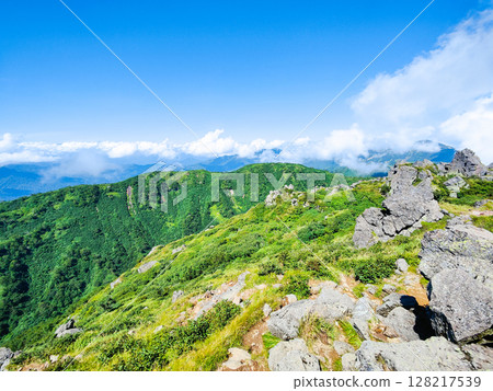 Climbing Mt. Myoko in summer (view of Mt. Mitahara from the summit of the south peak) Climbing Mt. Myoko in summer (view of Mt. Mitahara from the summit of the south peak) 128217539