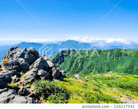 Climbing Mt. Myoko in summer (view of Mt. Kurohime and Mt. Takatsuma from the summit of the southern peak) 128217542