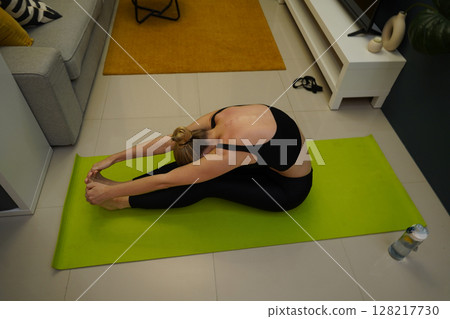 A young woman have a joyfully yoga practice A young woman have a joyfully yoga practice 128217730