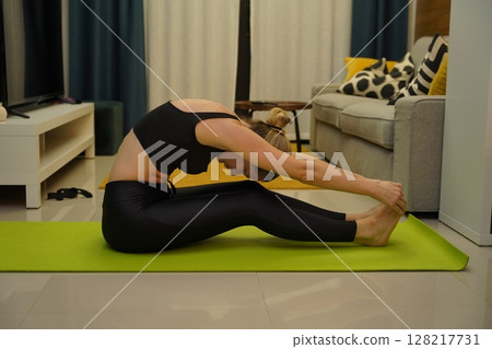 A young woman have a joyfully yoga practice A young woman have a joyfully yoga practice 128217731