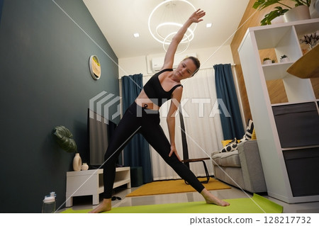 A young woman have a joyfully yoga practice A young woman have a joyfully yoga practice 128217732