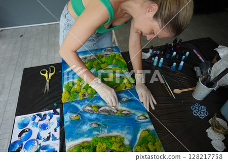 The process of making the art decor of epoxy resin, natural stones and moss The process of making the art decor of epoxy resin, natural stones and moss 128217758