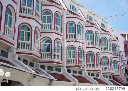 Detailed view of windows, doors and balconies of city buildings  128217799