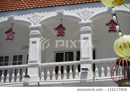 Detailed view of windows, doors and balconies of city buildings  128217808