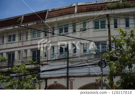 Detailed view of windows, doors and balconies of city buildings  128217818