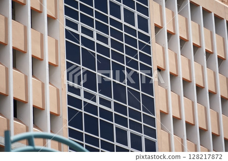 Detailed view of windows, doors and balconies of city buildings  128217872