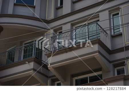 Detailed view of windows, doors and balconies of city buildings Detailed view of windows, doors and balconies of city buildings 128217884