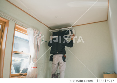 Air conditioning installation work 128217947