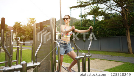 A young woman enjoying an workout outdoors  128218249