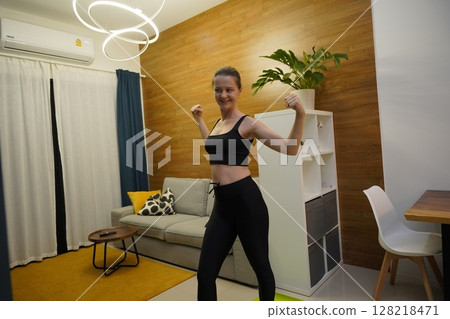 A young woman have a joyfully yoga practice  128218471