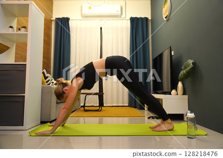 A young woman have a joyfully yoga practice A young woman have a joyfully yoga practice 128218476