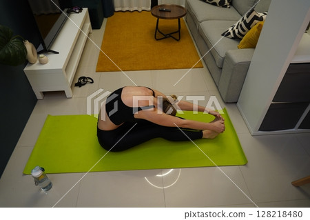 A young woman have a joyfully yoga practice  128218480