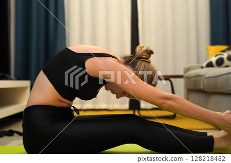 A young woman have a joyfully yoga practice  128218482