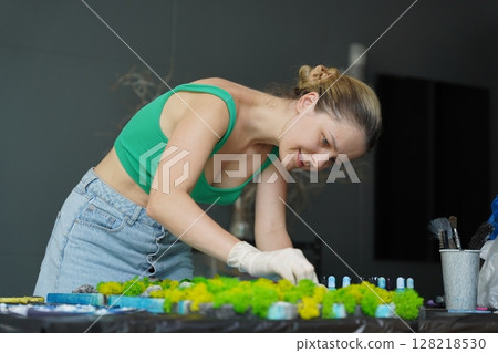 The process of making the art decor of epoxy resin, natural stones and moss The process of making the art decor of epoxy resin, natural stones and moss 128218530