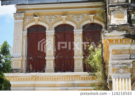Detailed view of windows, doors and balconies of city buildings  128218583