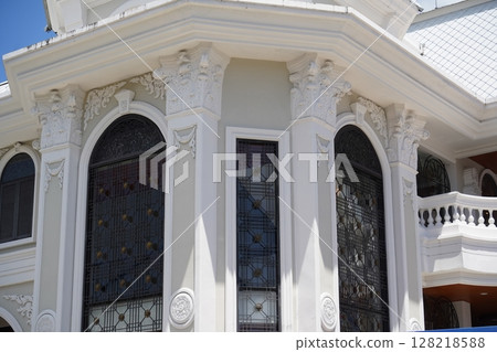 Detailed view of windows, doors and balconies of city buildings  128218588