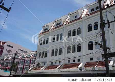 Detailed view of windows, doors and balconies of city buildings  128218591