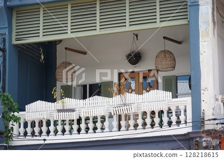 Detailed view of windows, doors and balconies of city buildings  128218615