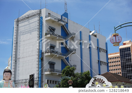 Detailed view of windows, doors and balconies of city buildings  128218649