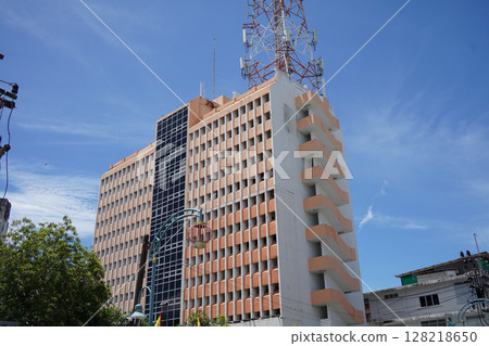 Detailed view of windows, doors and balconies of city buildings  128218650
