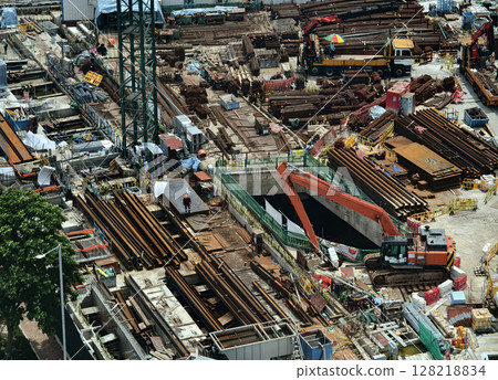 An aerial perspective showcasing a construction site located in a bustling city An aerial perspective showcasing a construction site located in a bustling city 128218834